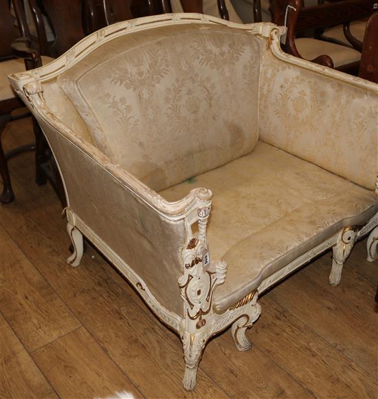 A Louis XV style cream and gilt small settee